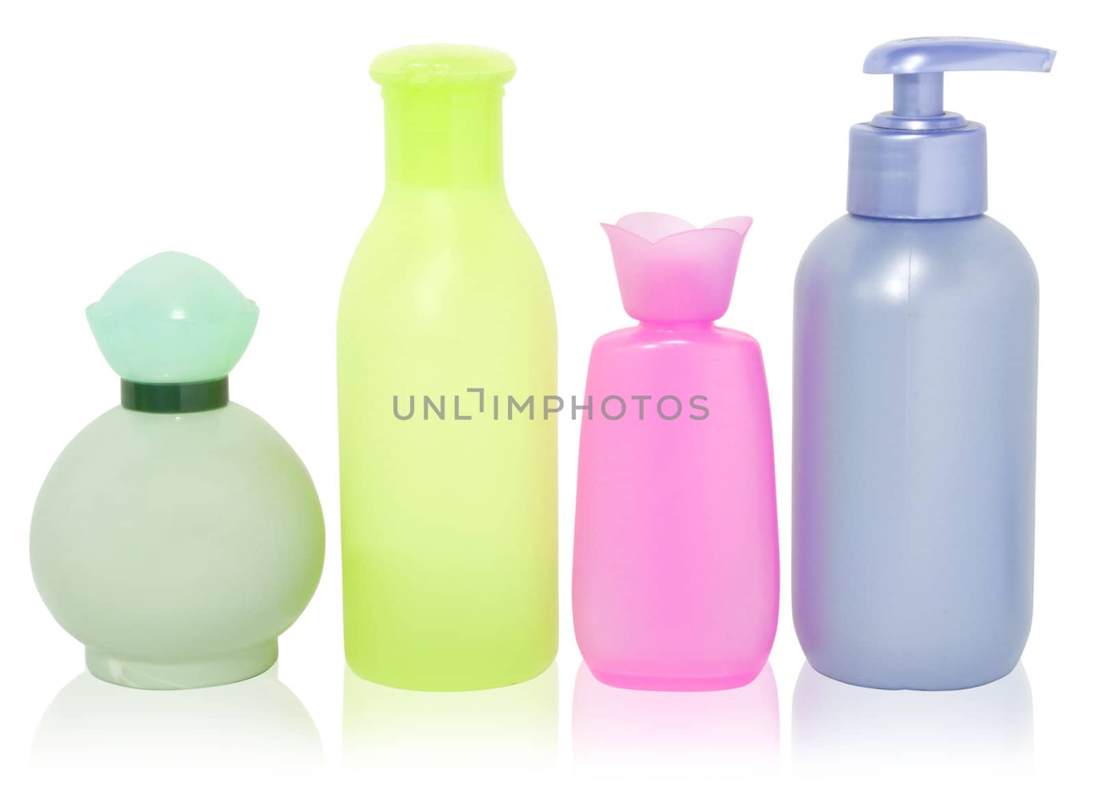 set of different colorful cosmetics bottles isolated over white with clipping path