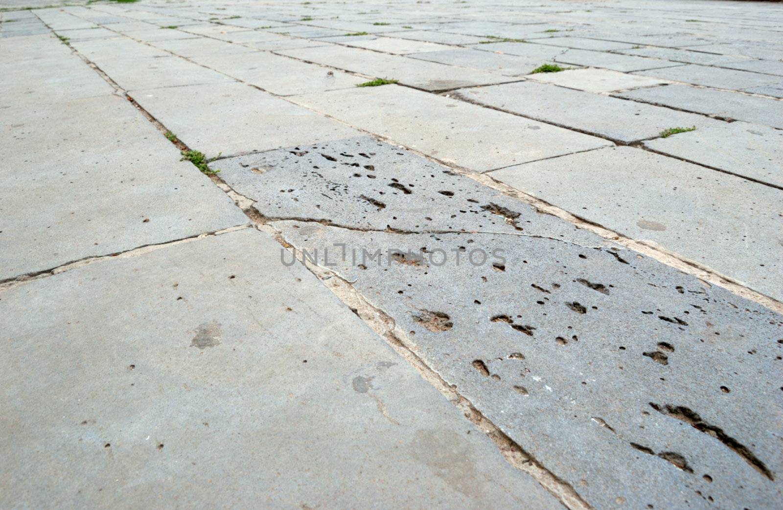 close-up of new old-style pavement of bricks of grey color