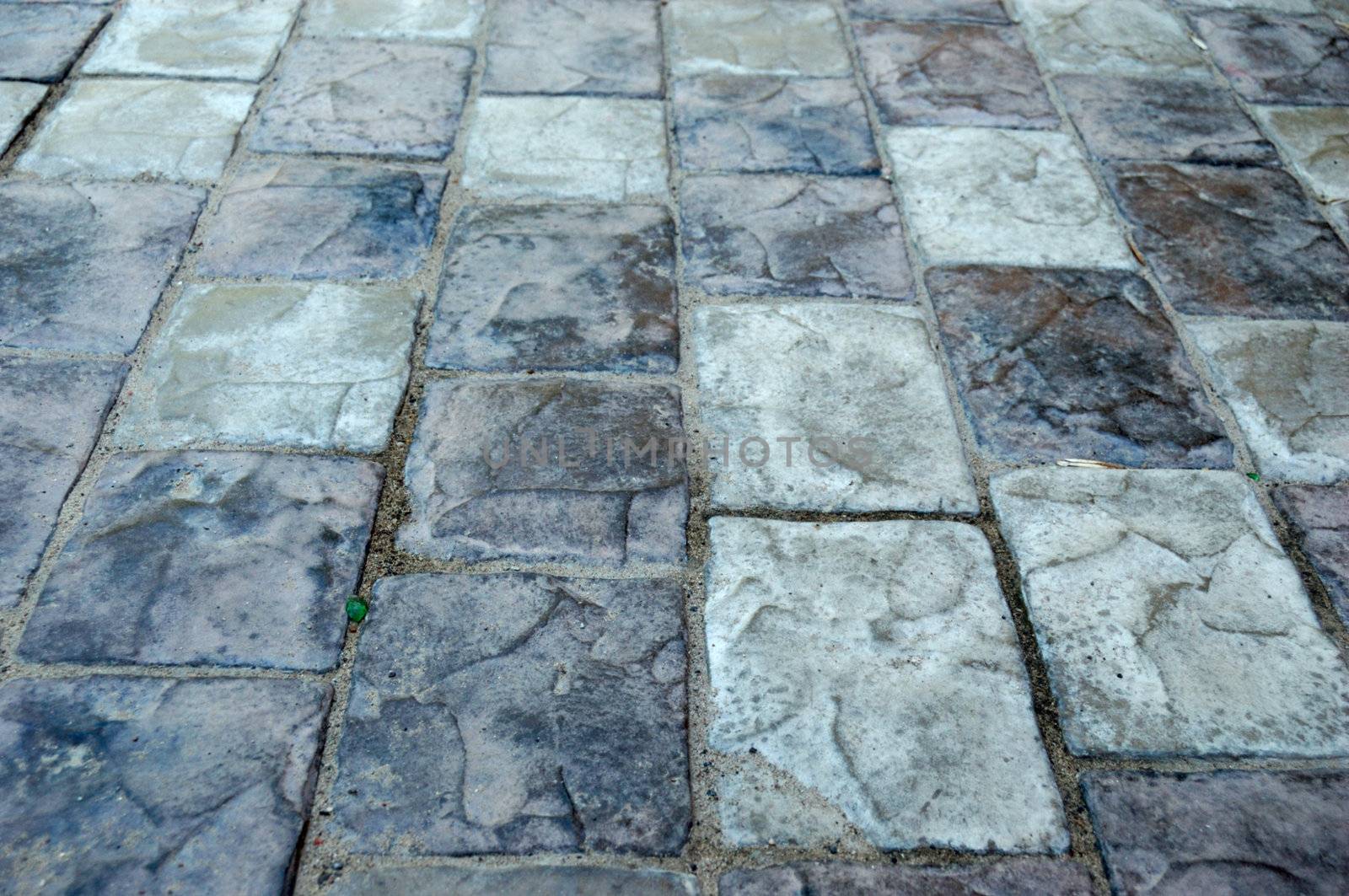 close-up of new old-style pavement of bricks of grey color