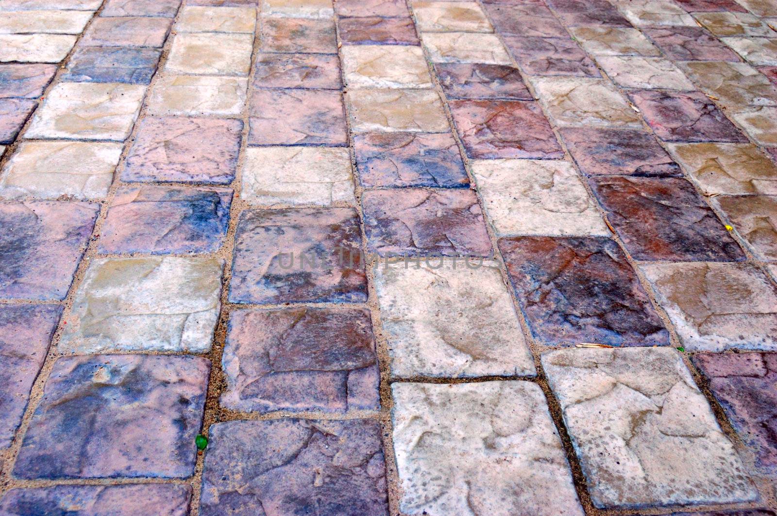 close-up of colorful old-style pavement of stoneblocks