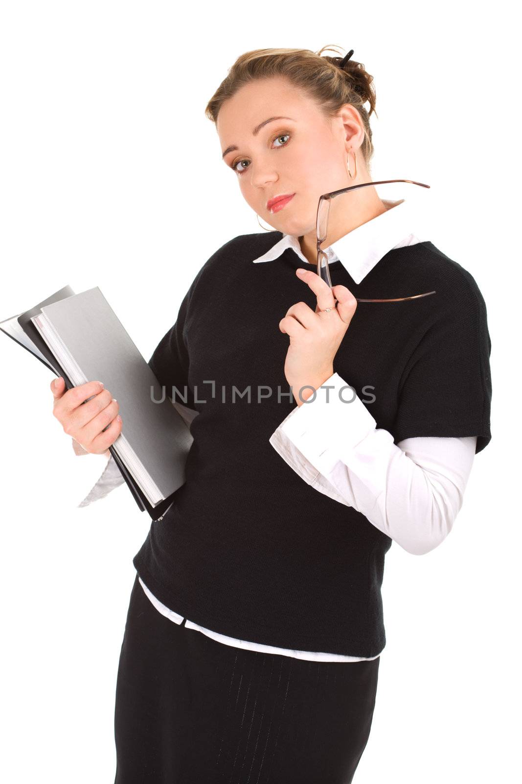 Young teacher standing with some files in hands