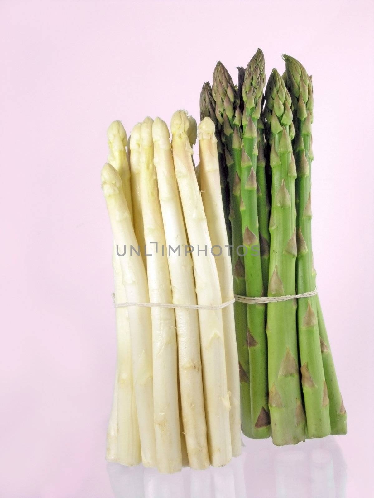  bunch of asparagus isolated on pink background