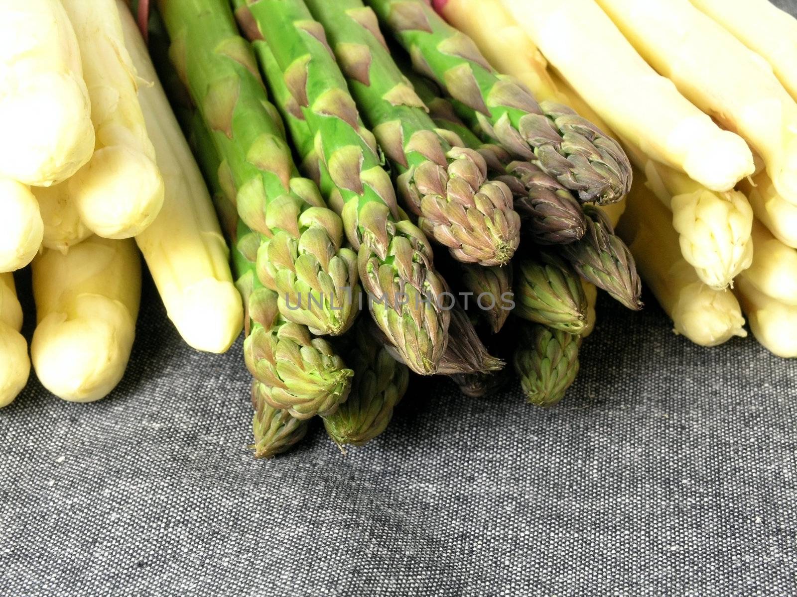  bunch of asparagus isolated on dark background