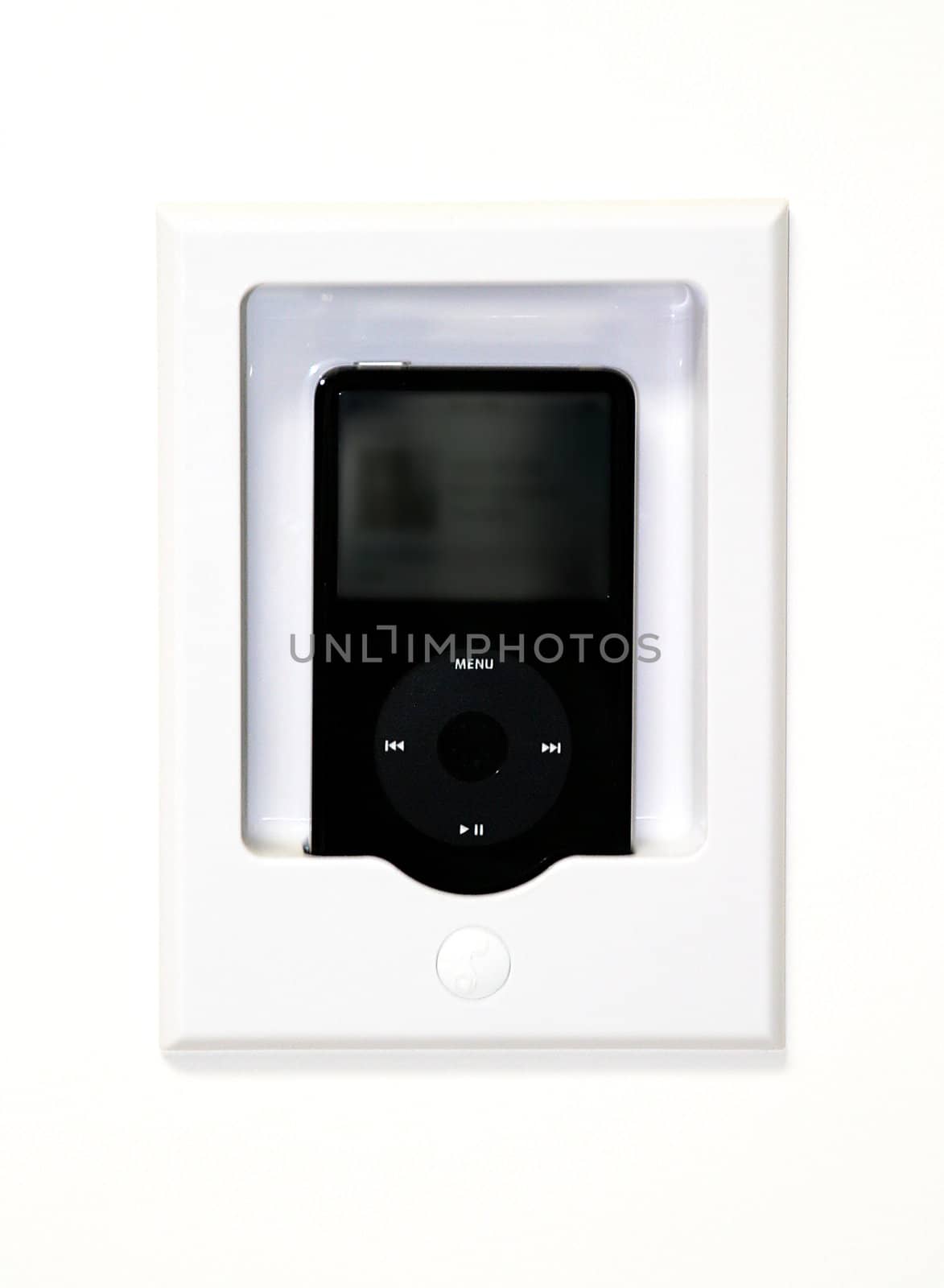 Black mp3 player in a white wall mounted station.