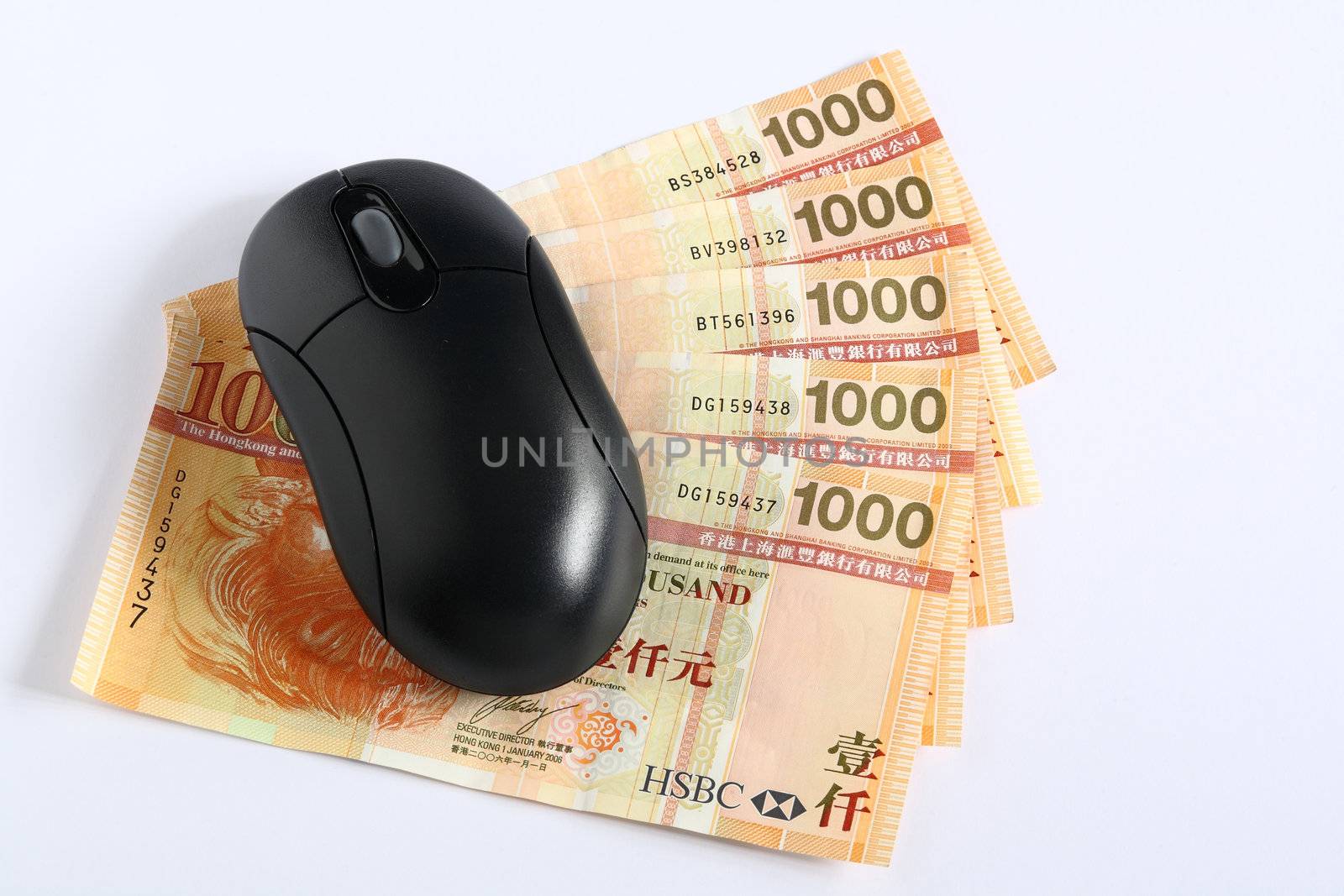 Using money online by a mouse.