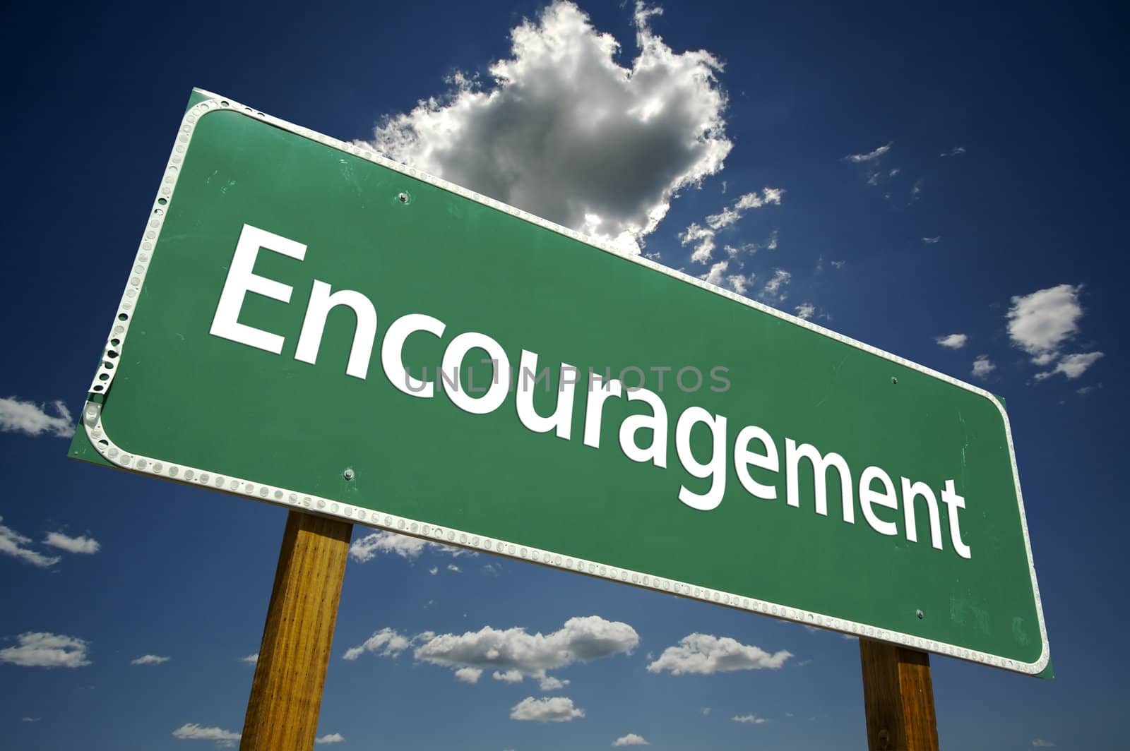 Encouragement Road Sign with dramatic clouds and sky.