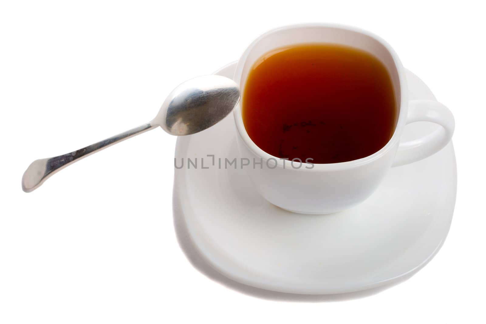 close-up cup of rooibos tea with spoon, isolated on white