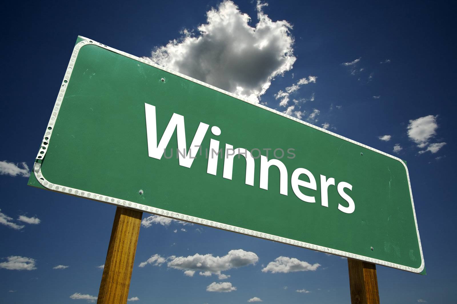 Winners Road Sign with dramatic clouds and sky.