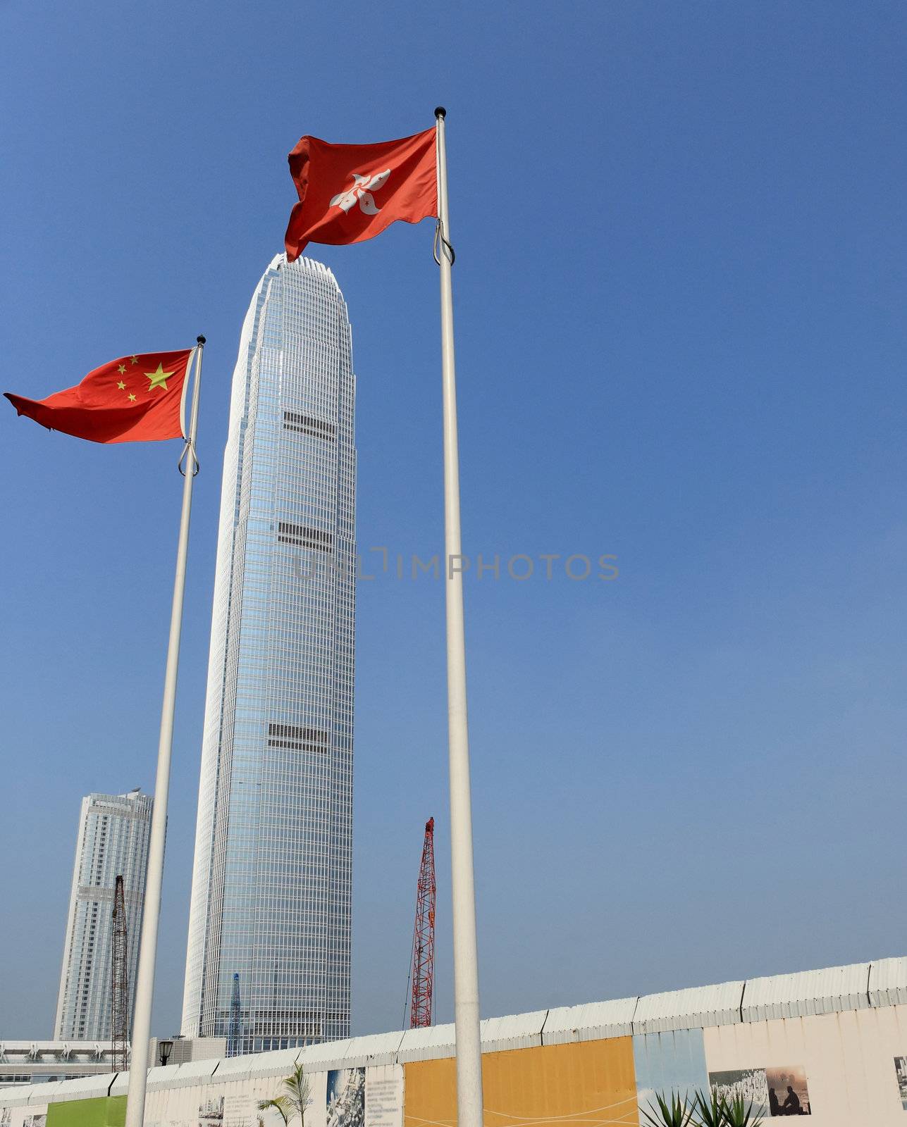 International Finance Centre (2IFC) skyscraper with Hong Kong and China Flags.