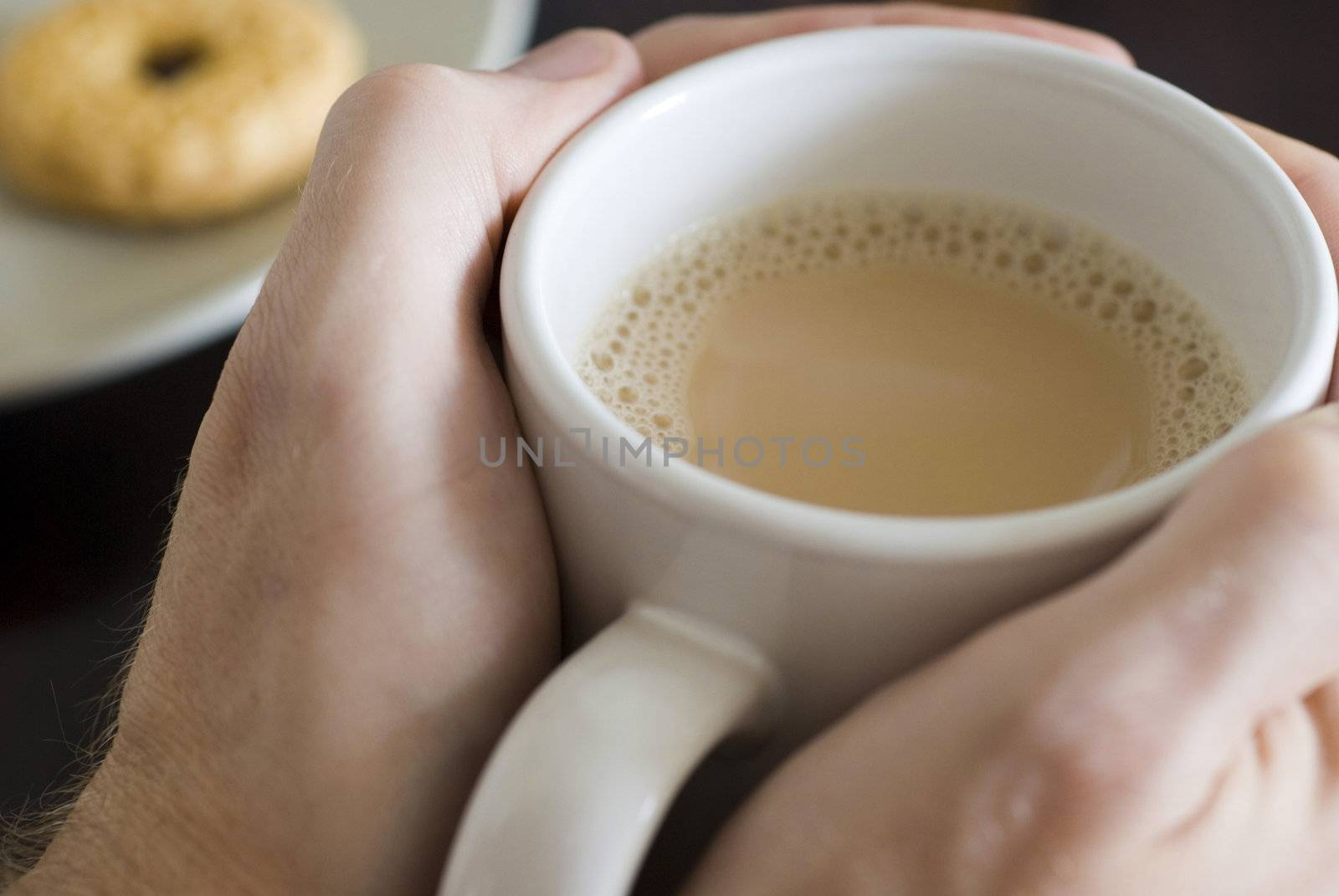 warming hands on a large mug of white tea