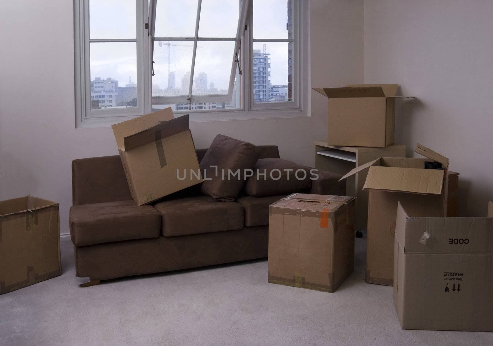 unpacking boxes after moving into a new apartment