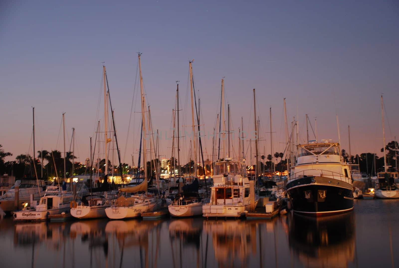 Boats in a harbor at dusk