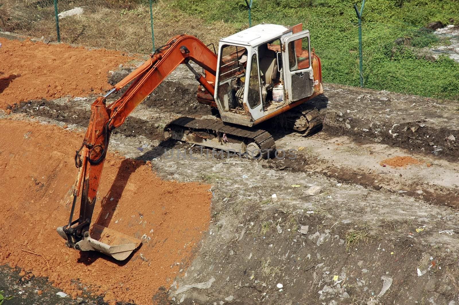 Caterpillar construction machine work in progress at construction site.