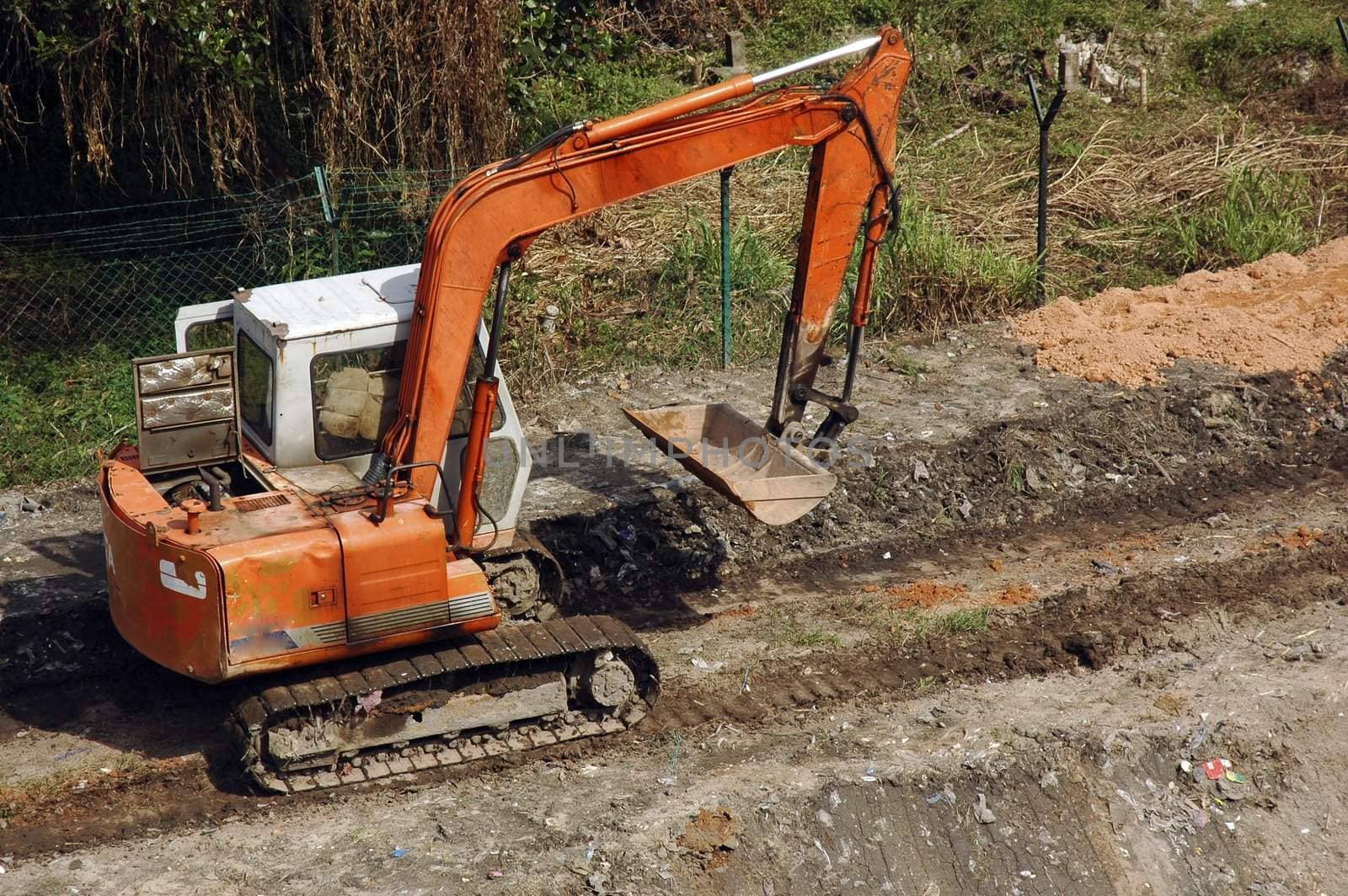 Caterpillar construction machine work in progress at construction site.