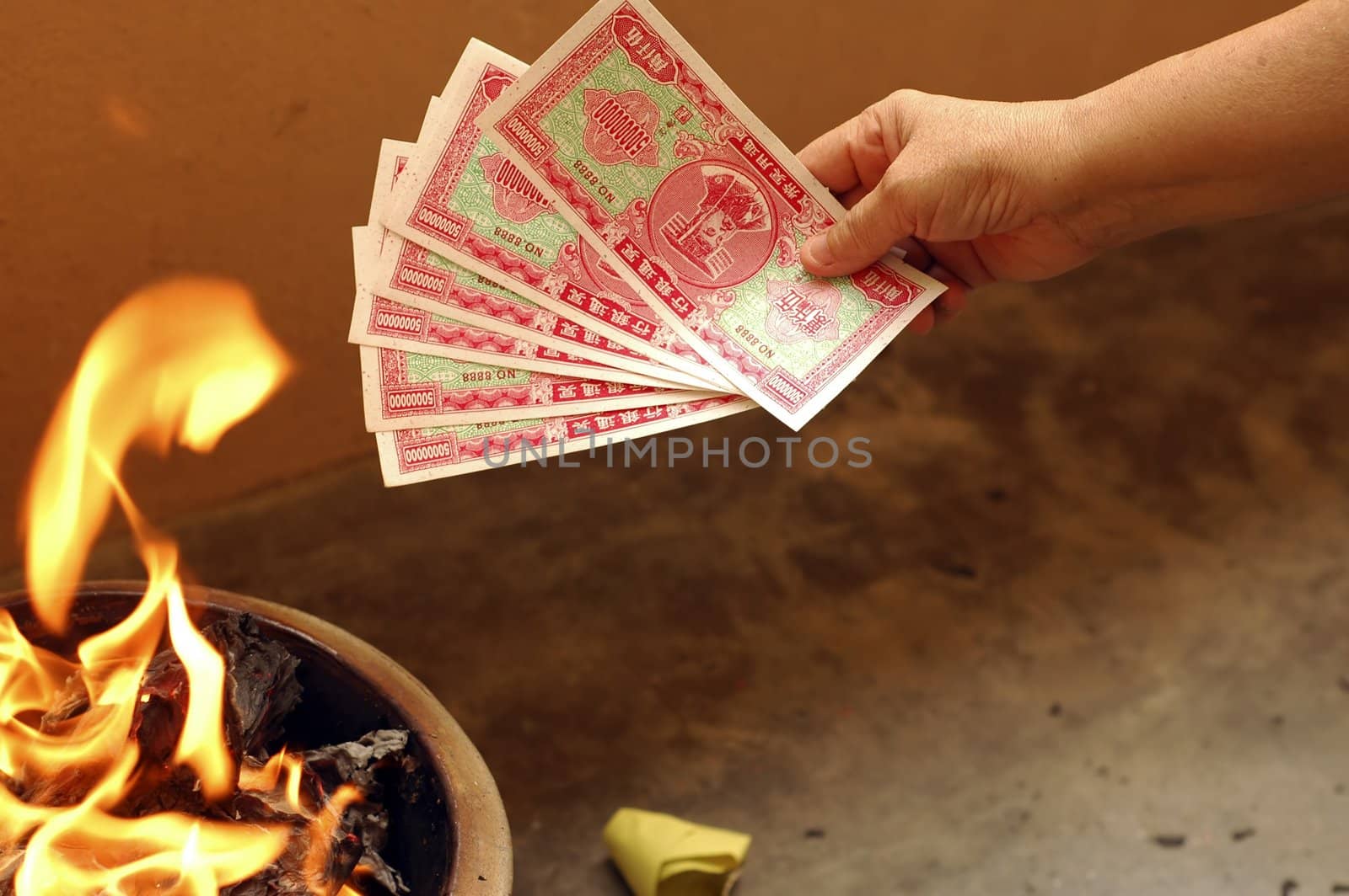 A typical burning fake money and gold for ancestors during Chinese Hungry Ghost Festival