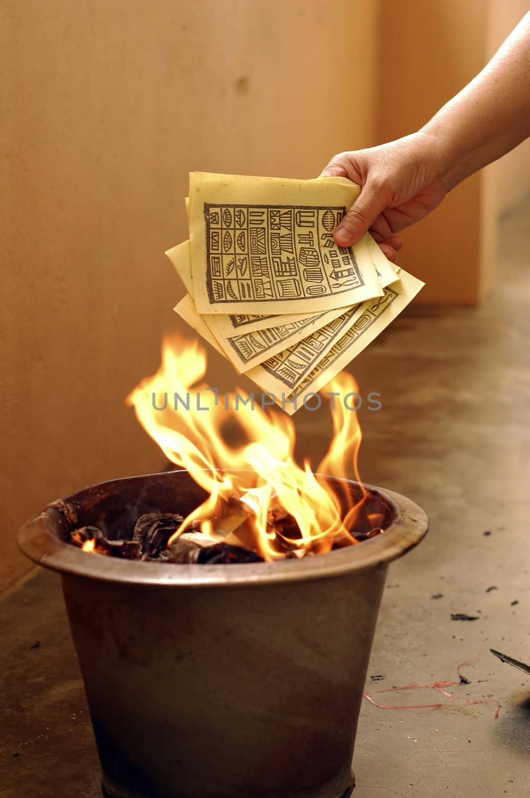 A typical burning fake money and gold for ancestors during Chinese Hungry Ghost Festival