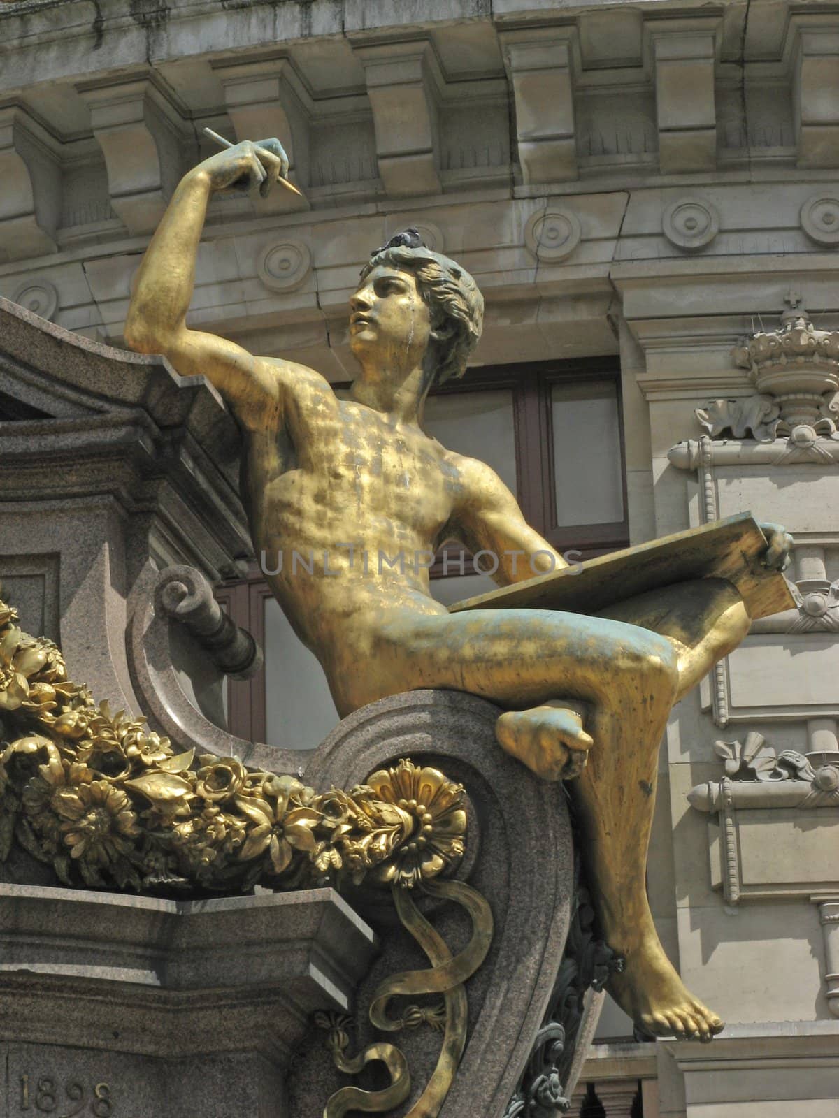 Golden statue in front of the opera Garnier in Paris