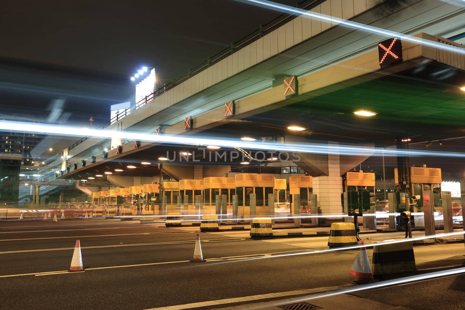 toll booths with car light in Hong Kong by leungchopan