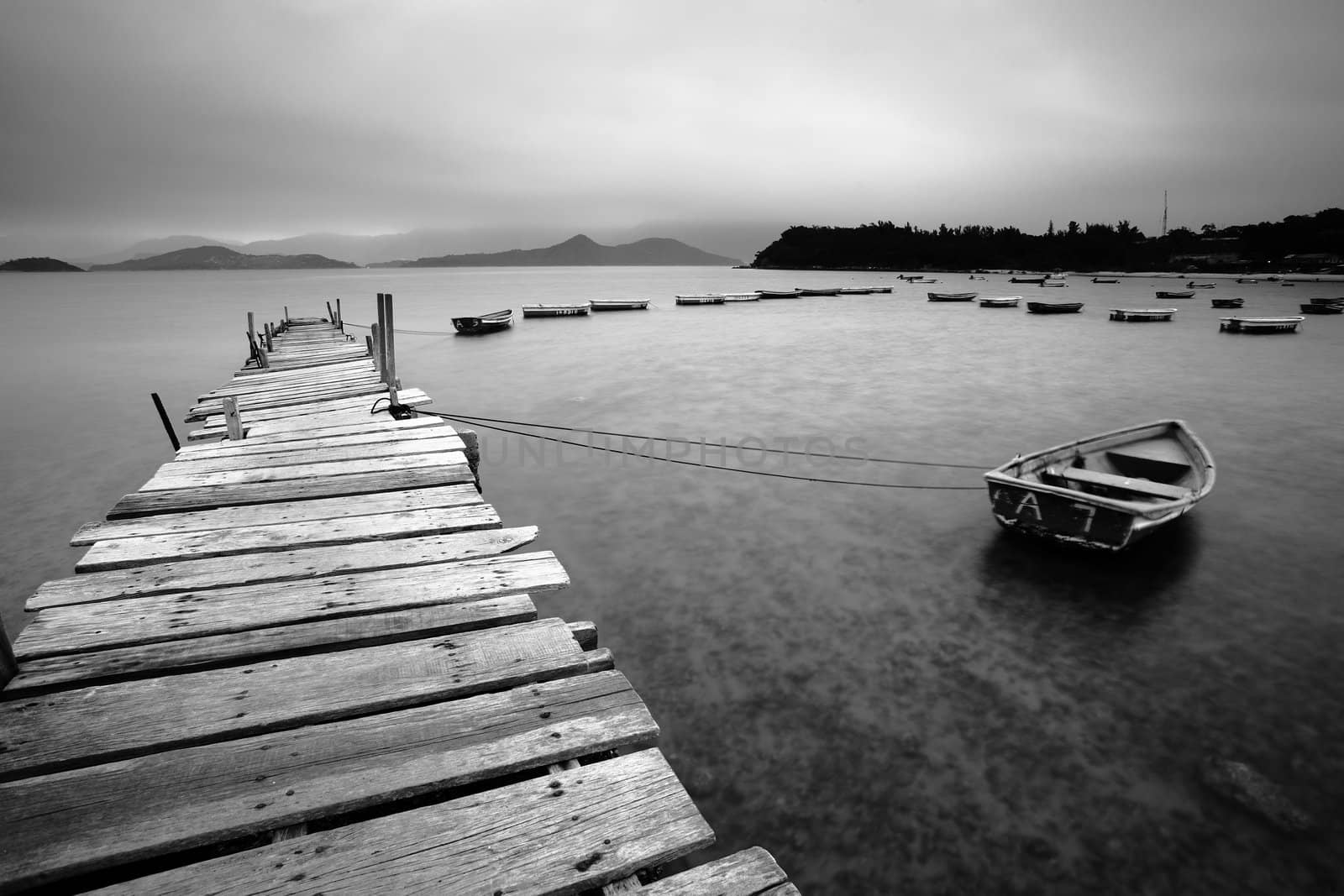 wooden pier and boats by leungchopan