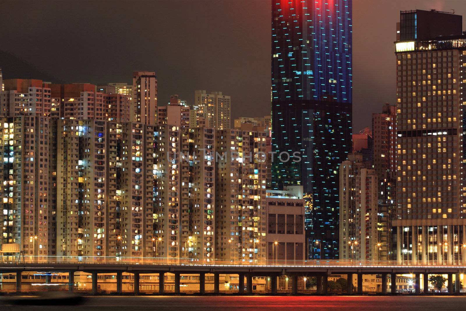 residential buildings at Hong Kong in night by leungchopan
