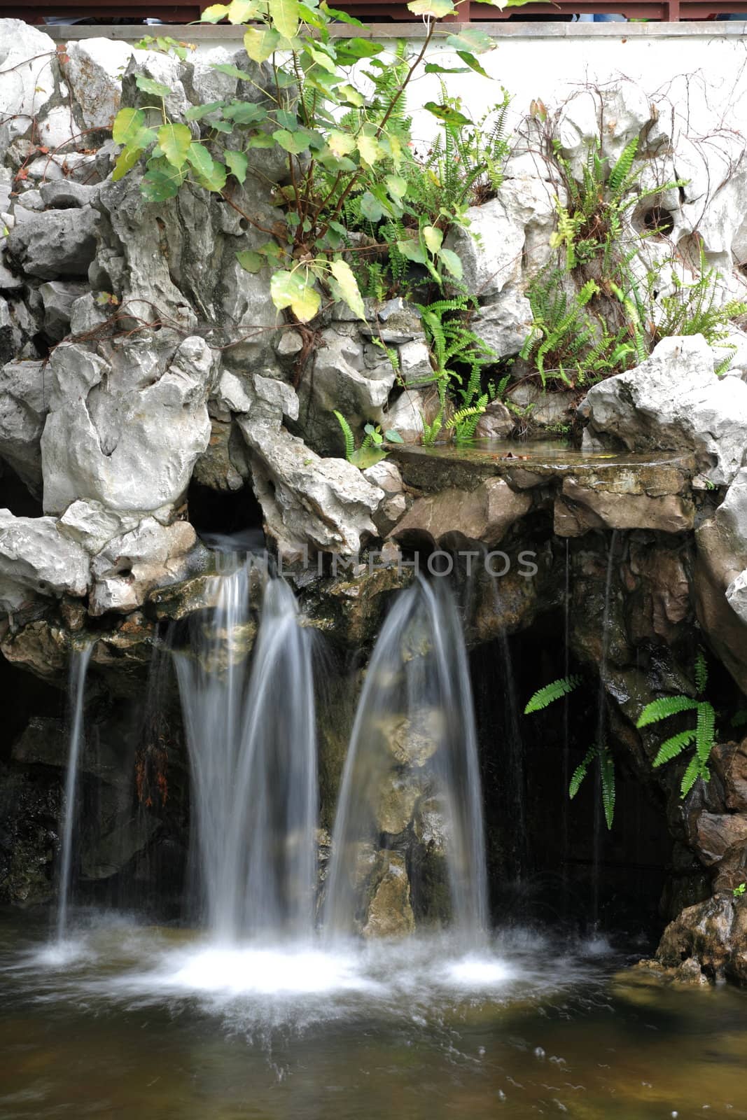 human made waterfall in Kowloon walled city park, Hong Kong