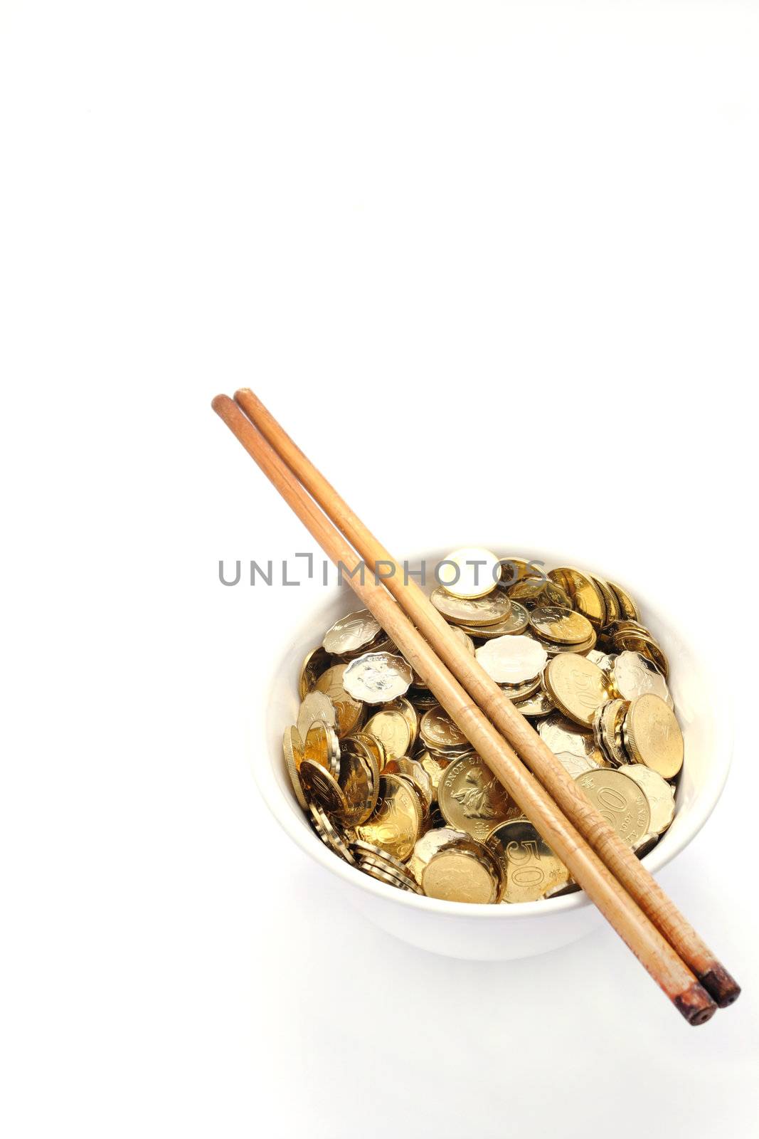 a bowl of money with chopsticks