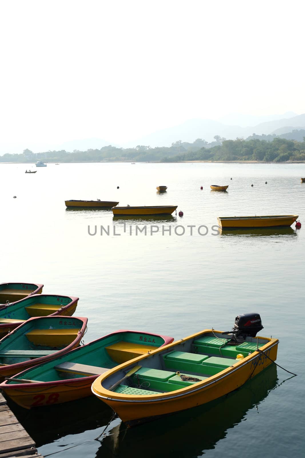 boats on lake by leungchopan