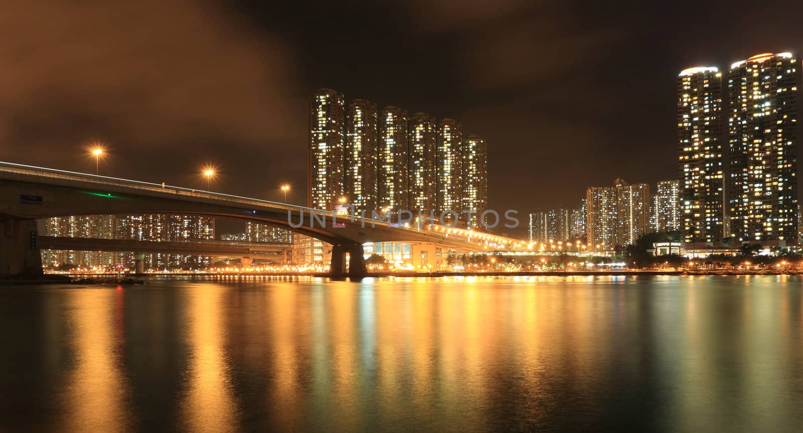Residential Apartment Buildings in Hong Kong at night by leungchopan
