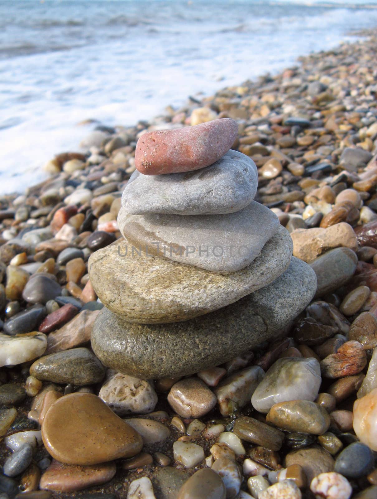 stack of pebbles on the sea shore