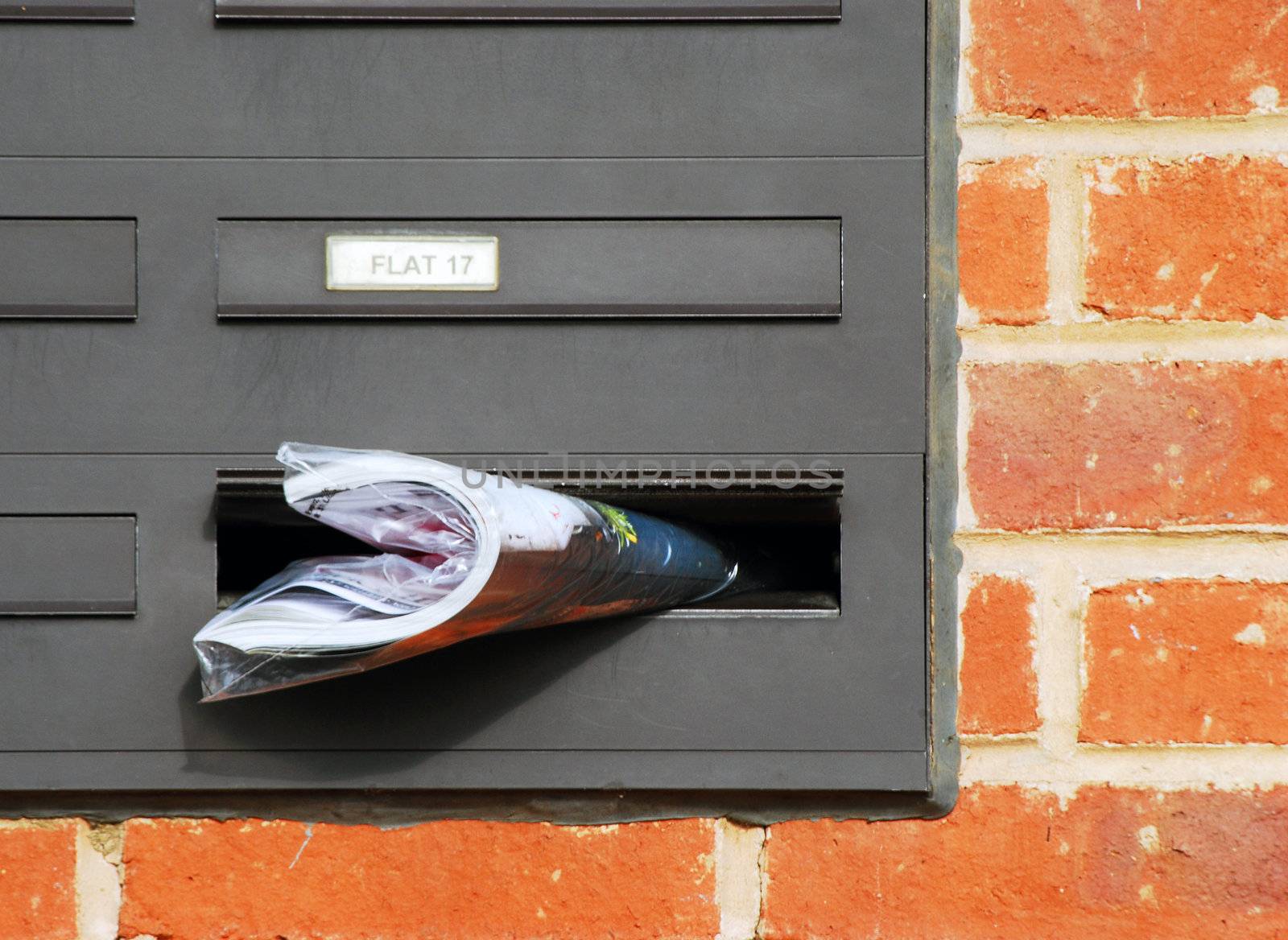 Catalogue or magazine sticks out from letterbox