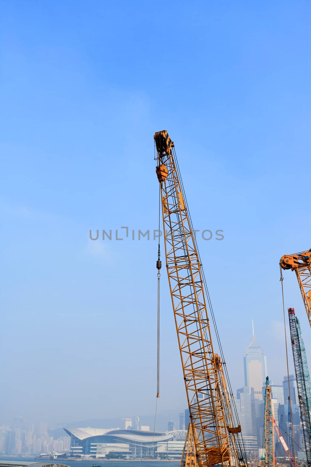 crane arm against a city background