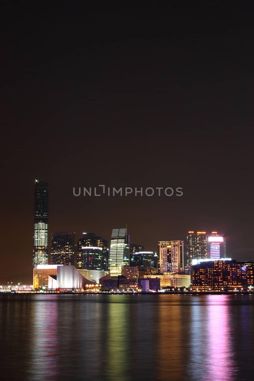 hong kong at night, many tall buildings