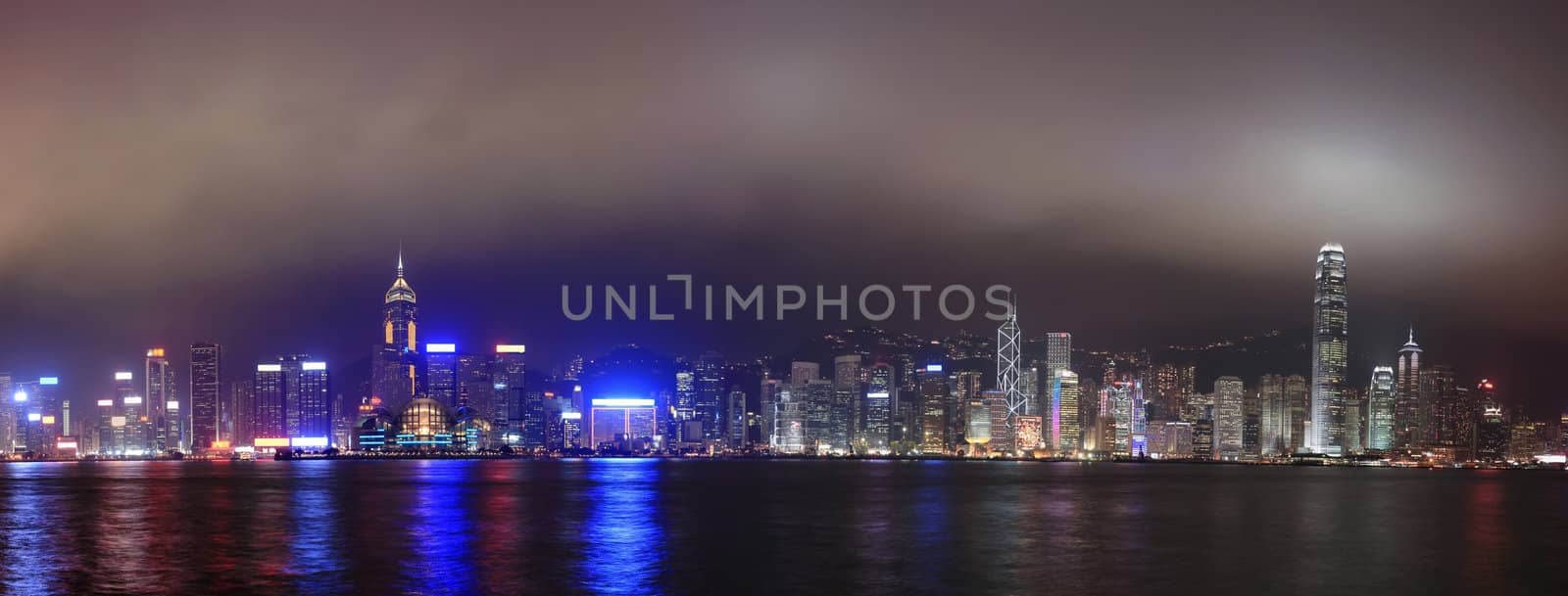 Panorama of the skyline of Hong Kong at night, with mist by leungchopan