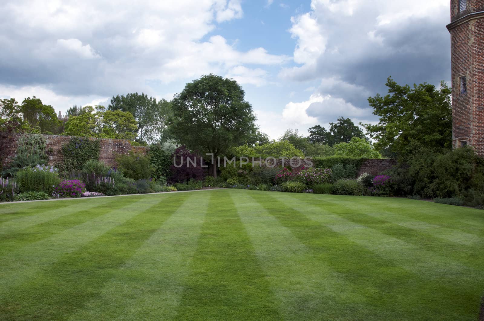 A cottage garden with an herbaceous border