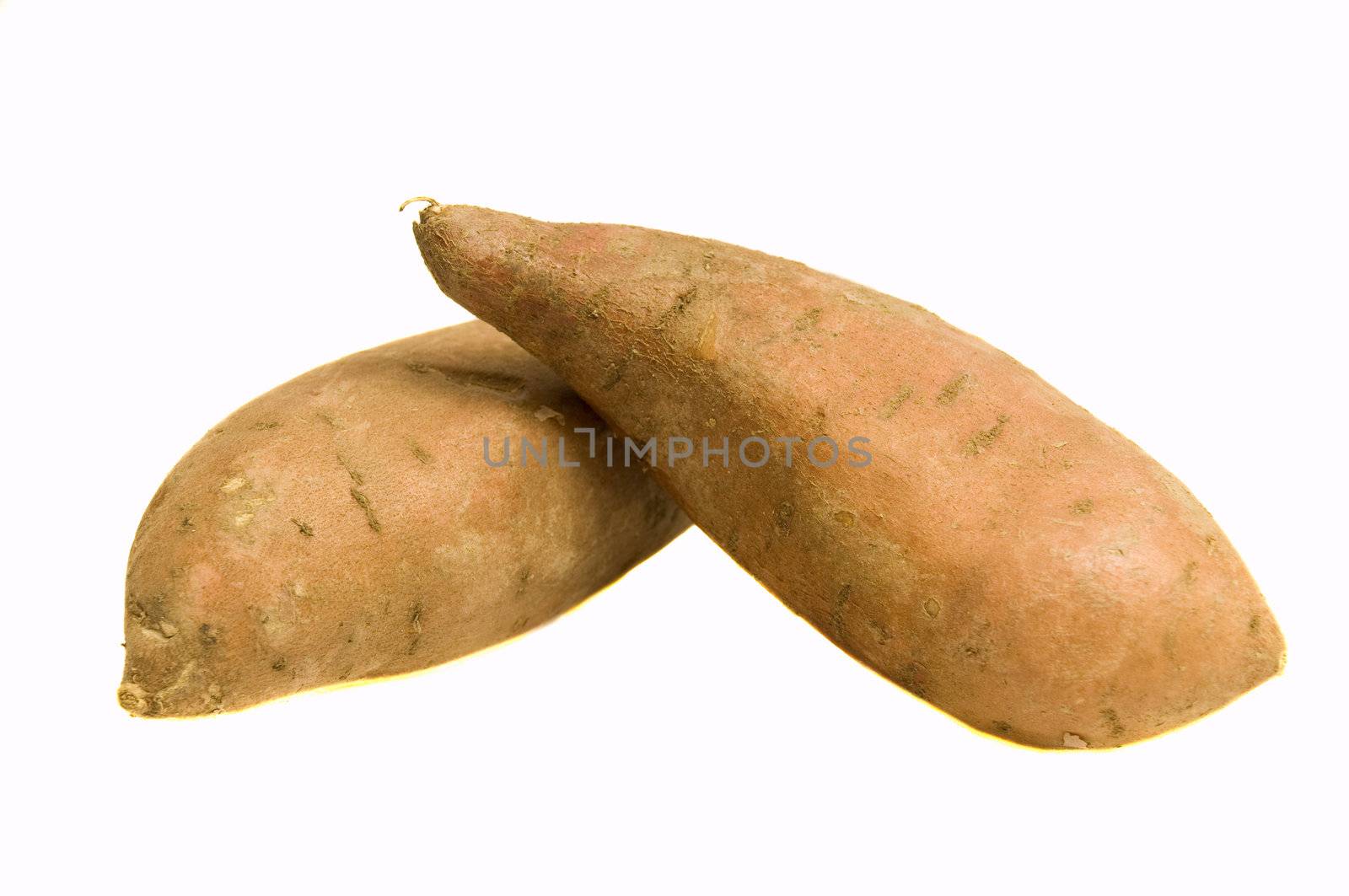 pair of fresh organic yams, isolated on white, with clipping path