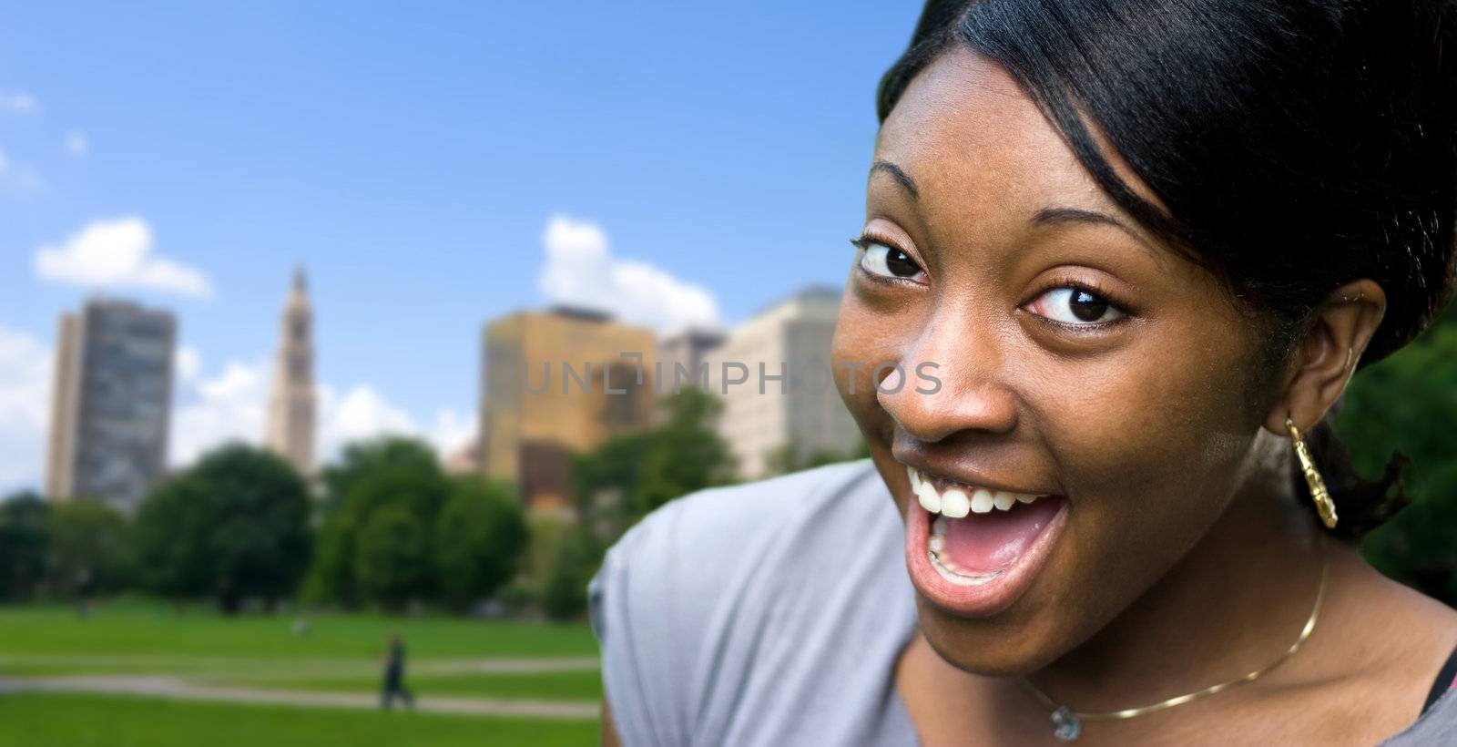 A happy or surprised young black woman posing in Hartford Connecticut.