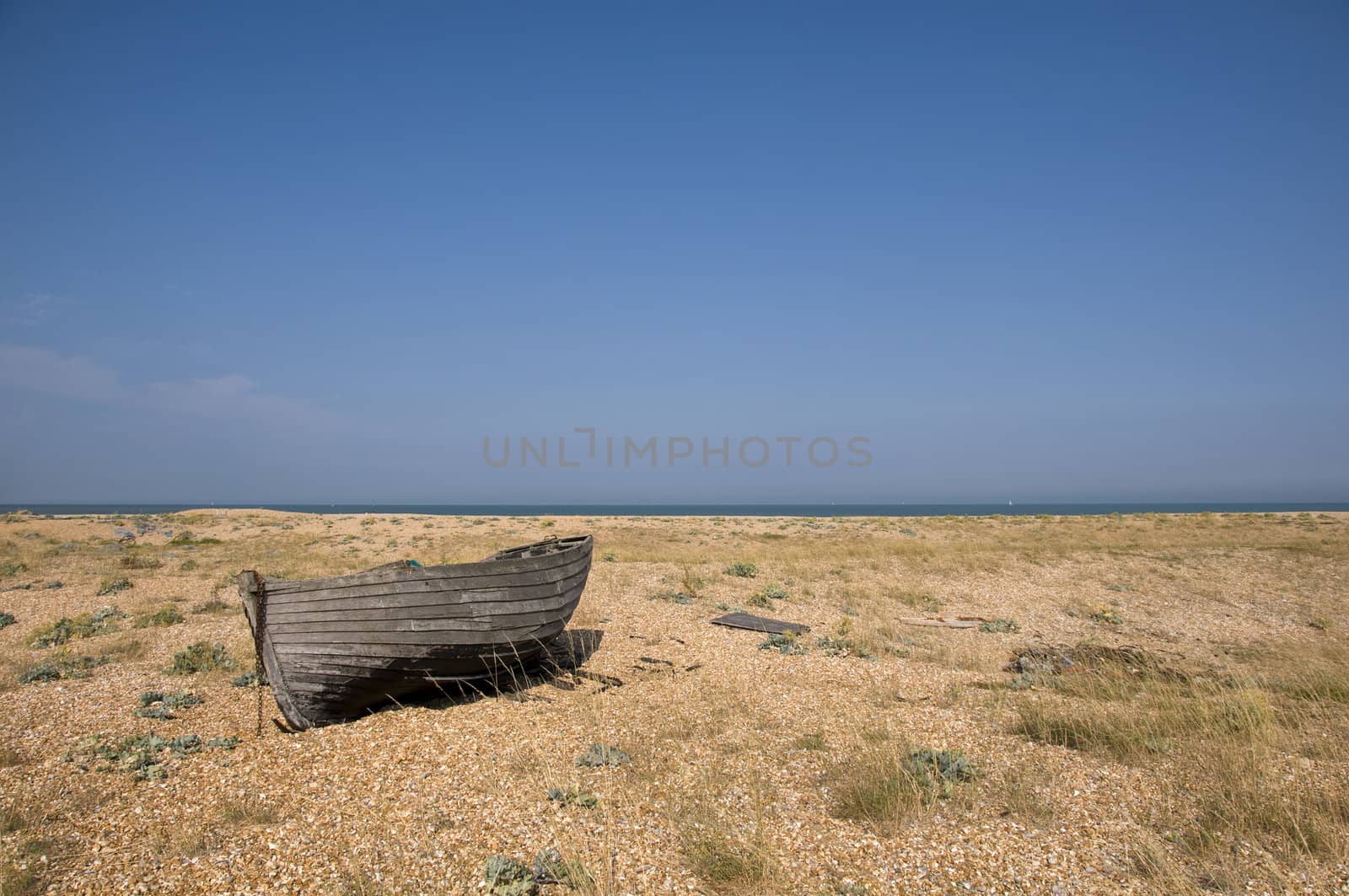 An old fishing boat on the beach at Dungeness