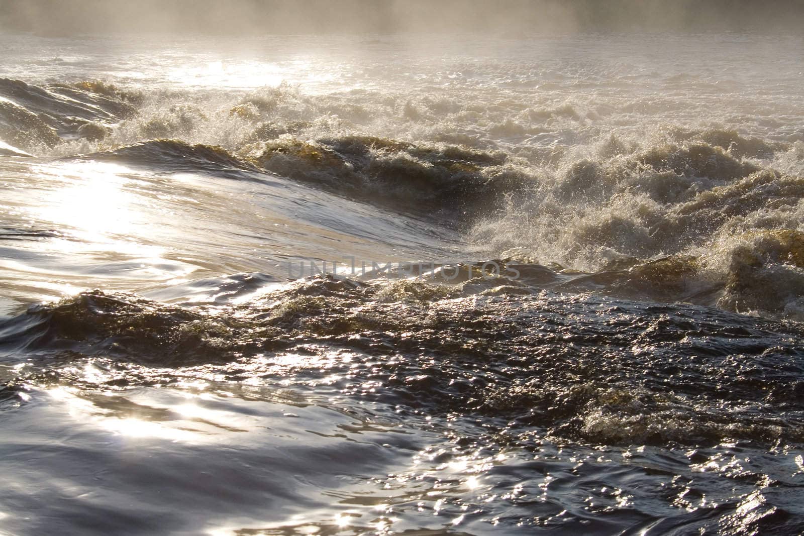 august foggy morning: river, foam; splashes
