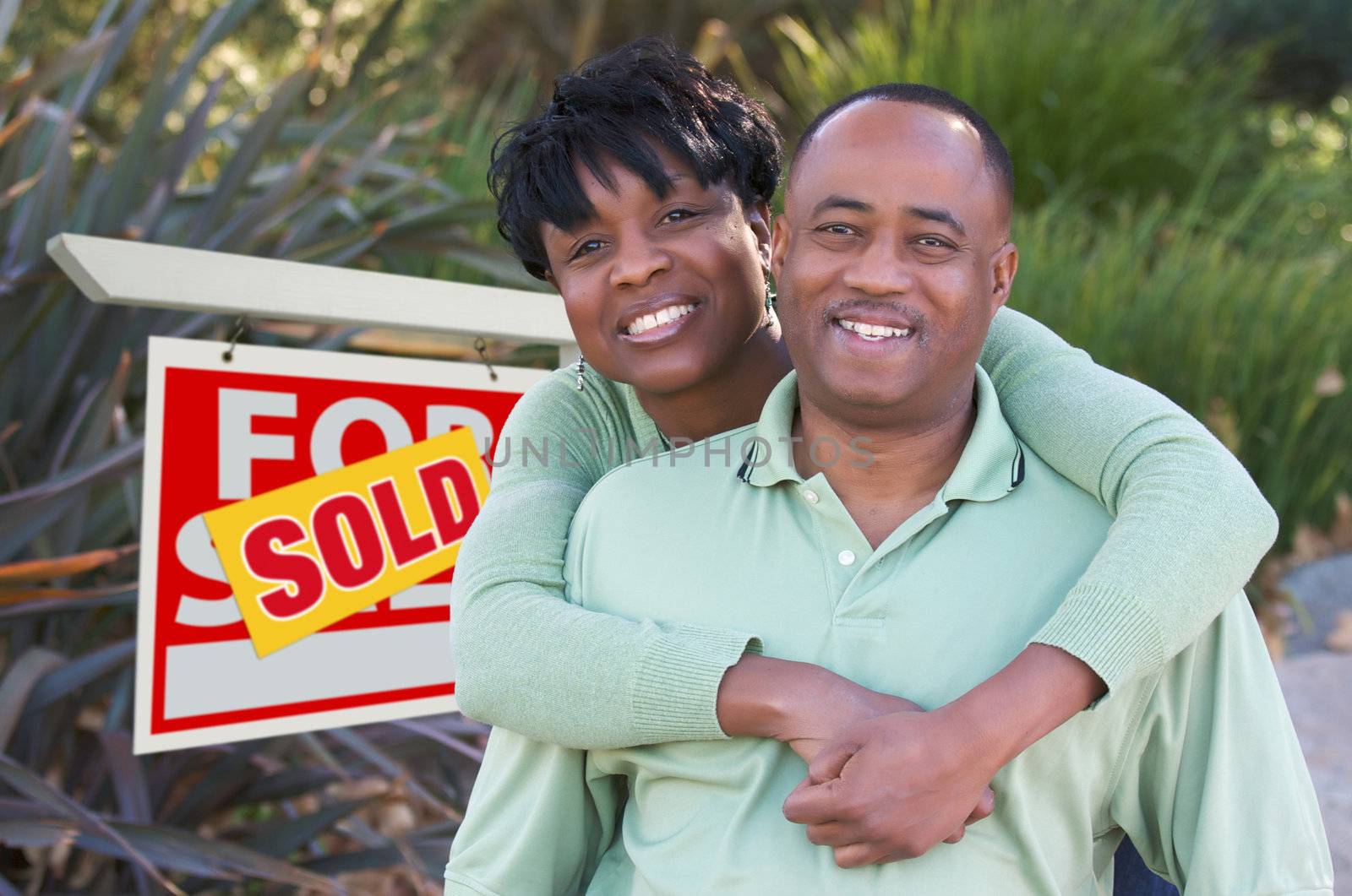 Happy Couple and Real Estate Sign by Feverpitched