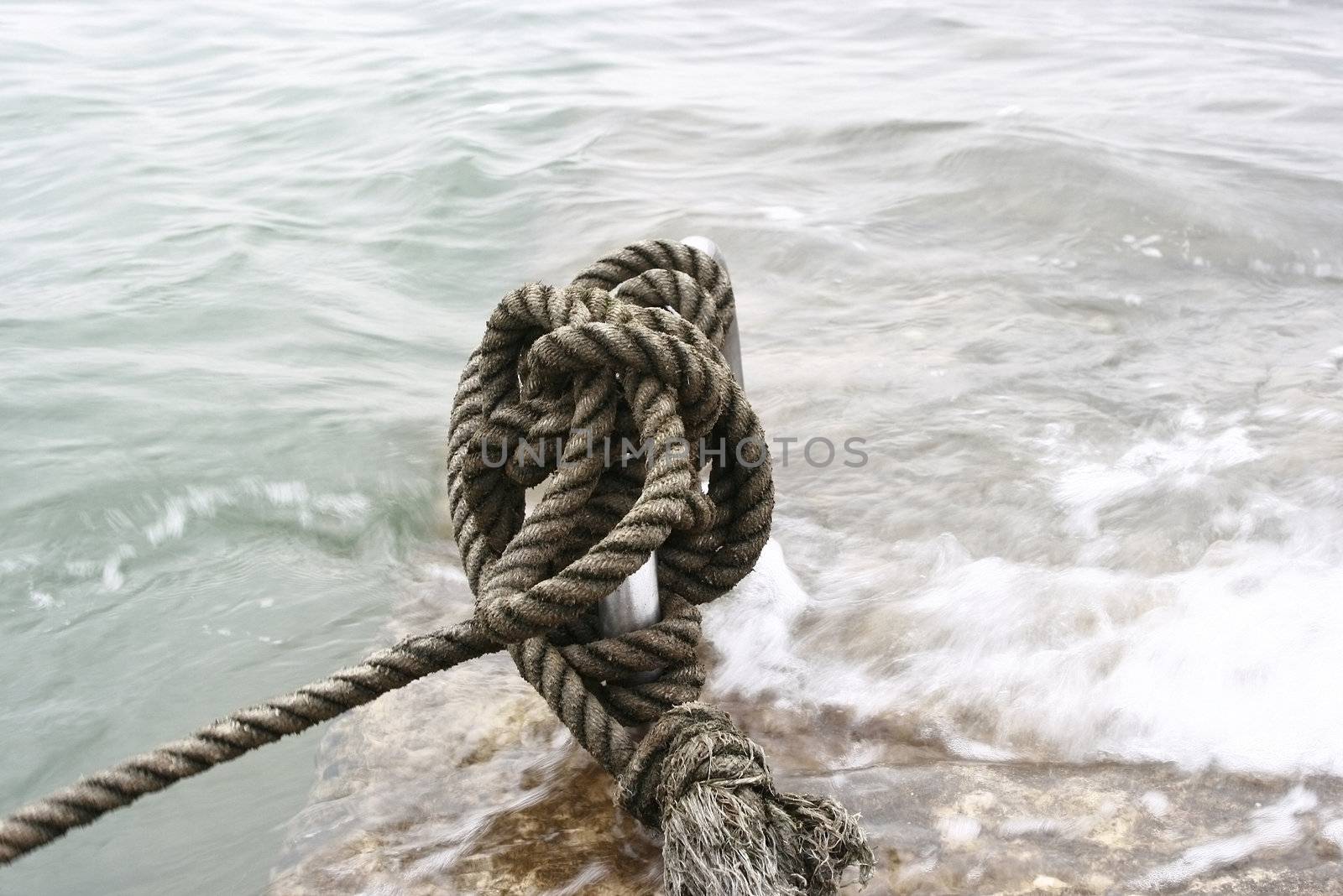 Manila Rope moored in a steel by the beach 