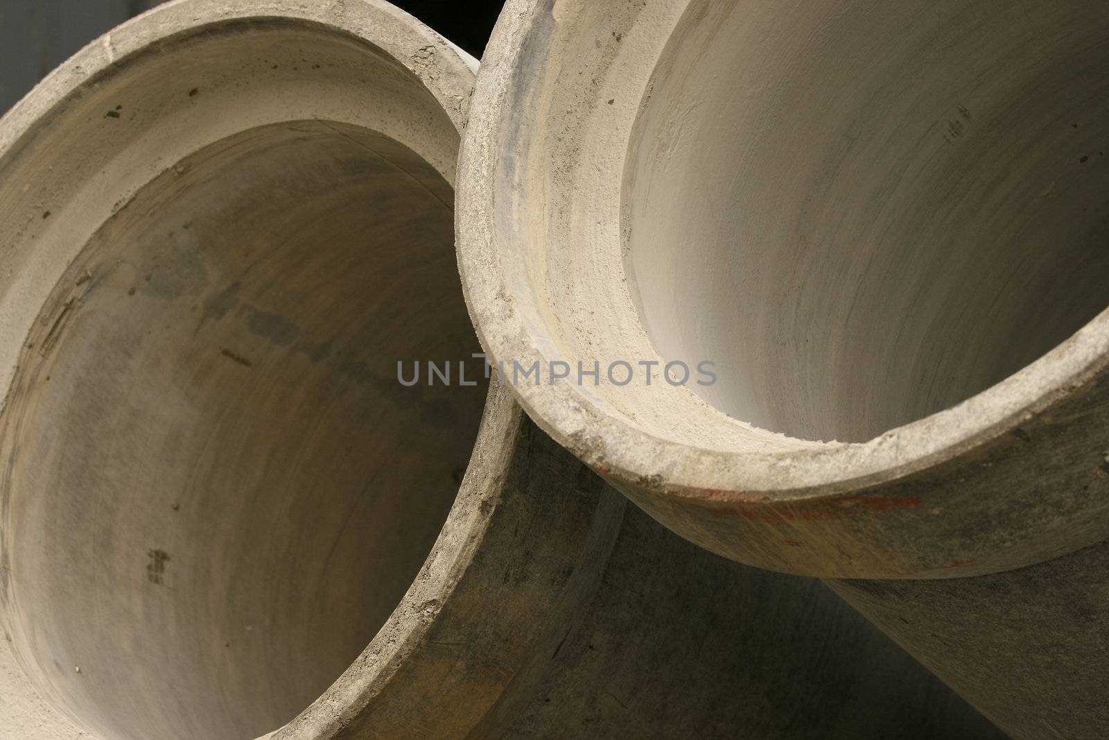 stack of concrete pipes on a construction site
