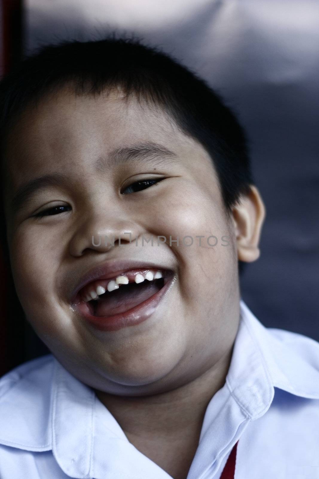 Adorable smile of a boy by sacatani