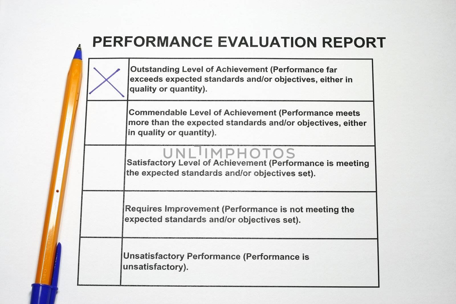 Outstanding evaluation blue pen on evaluation with outstanding crossed