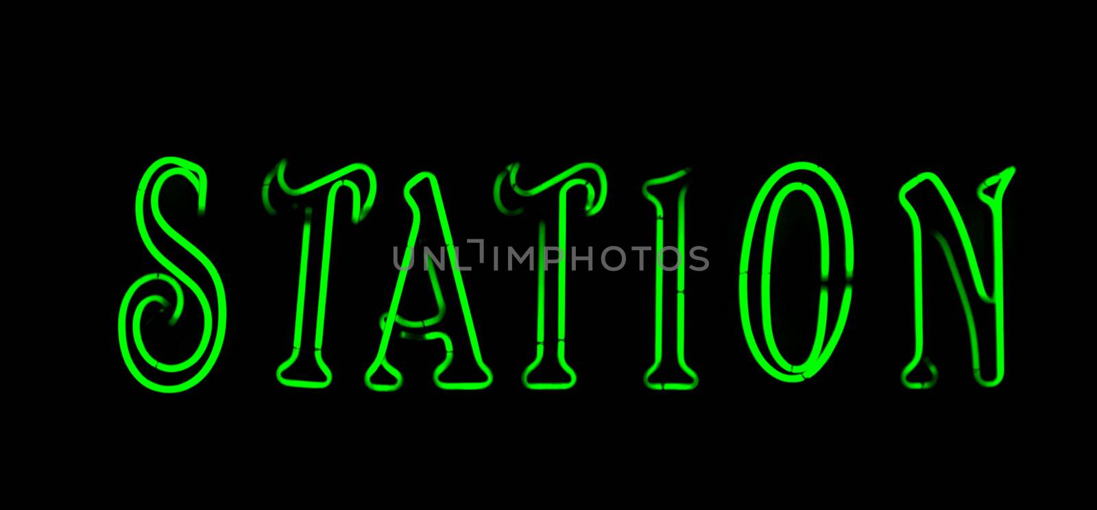 Green  station neon sign on black background