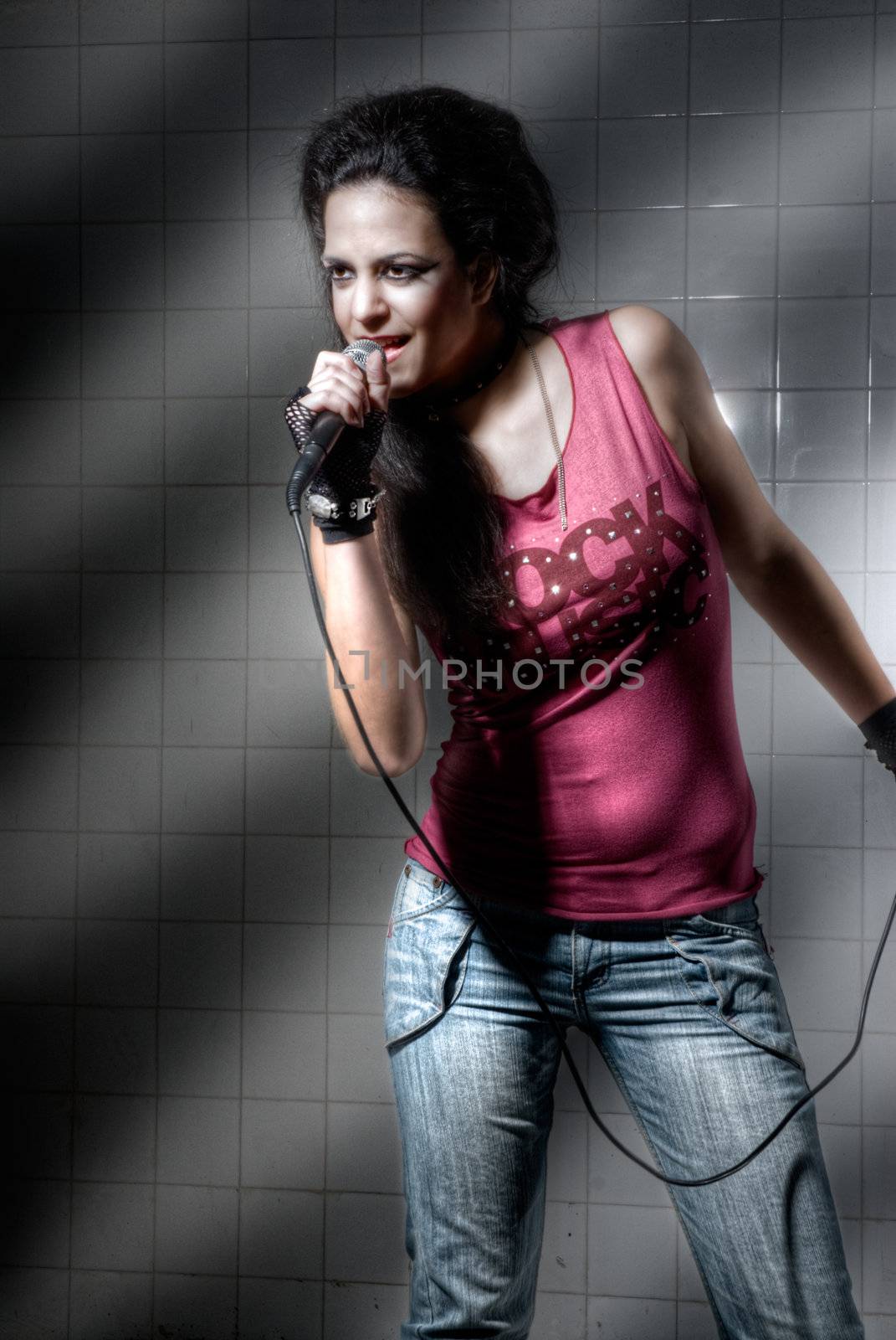 Punk Girl singin on an "underground" background