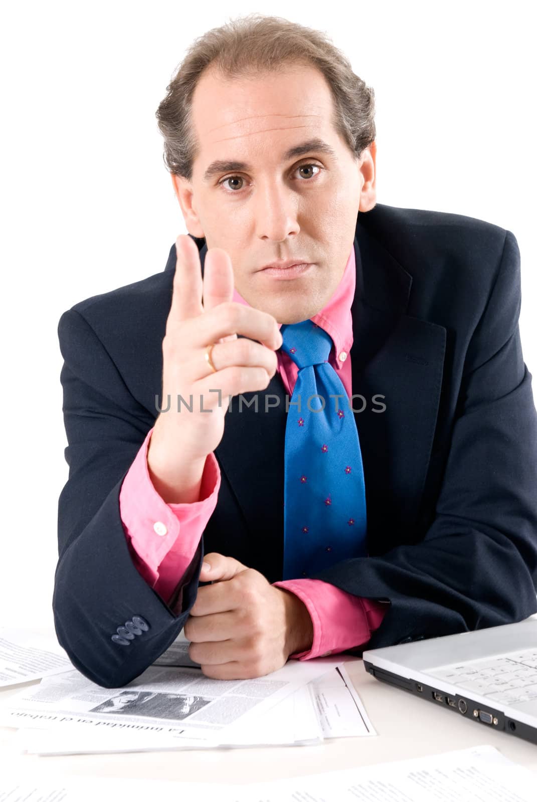 Businessman asking for explanations with laptop on white background. 