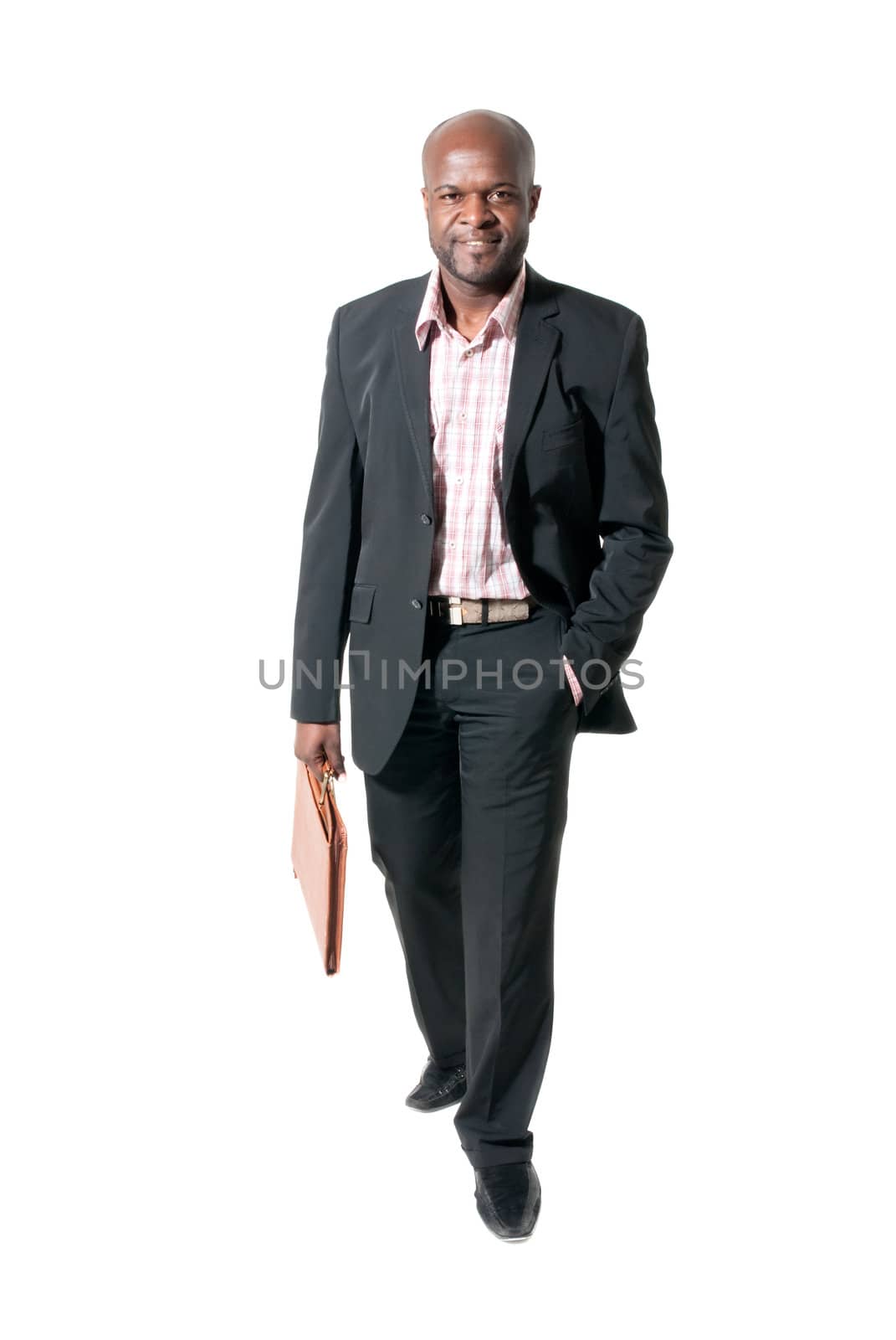 Happy african businessman smiling with briefcase isolated.