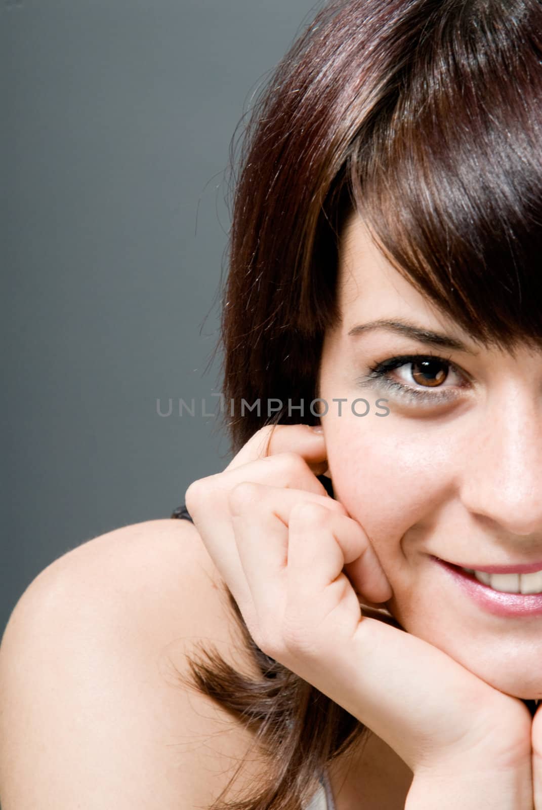 Young brunette girl smiling