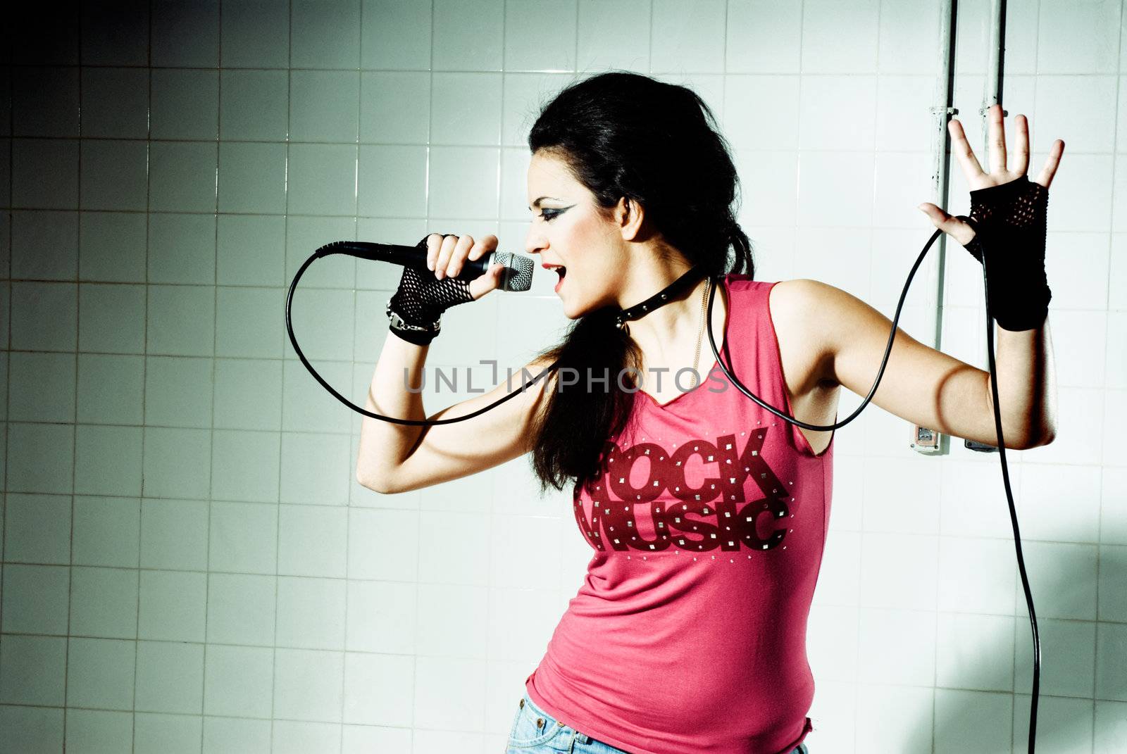 Punk Girl singing on an "underground" background high contrast