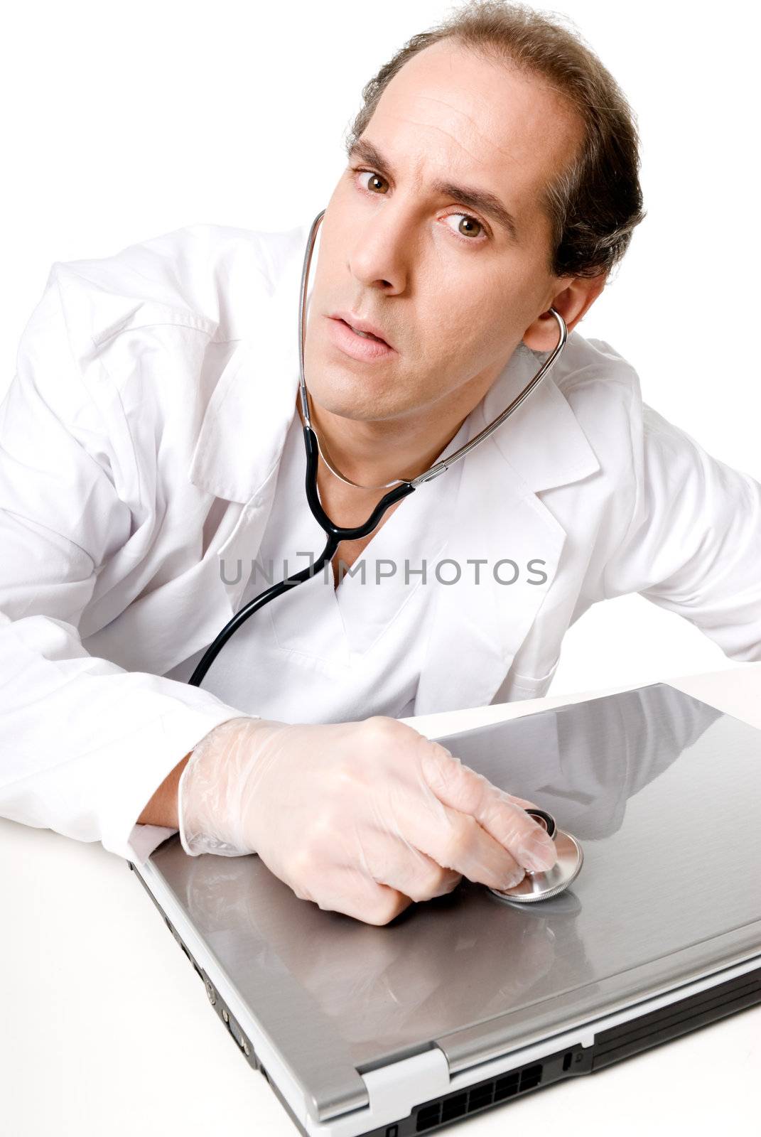 Doctor with stethoscope fixing laptop, good technical support symbol. 